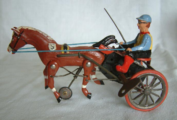 boxed mid 20th Century German D.G.M. clock work wind up Horse racing toy